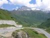 Bild 14: Im Hintergrund sieht man schwach die Strasse im Zickzack zum Pass rauf
